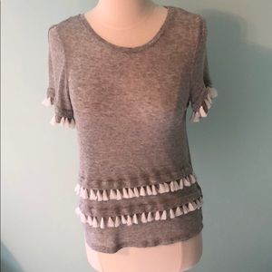 Gray top with white tassels